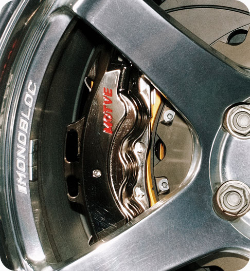 MOTVE brake caliper fitted behind a wheel